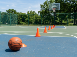Players practicing basketball defense drills on the court