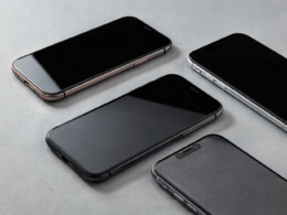 Several modern smartphones arranged on a minimal light surface