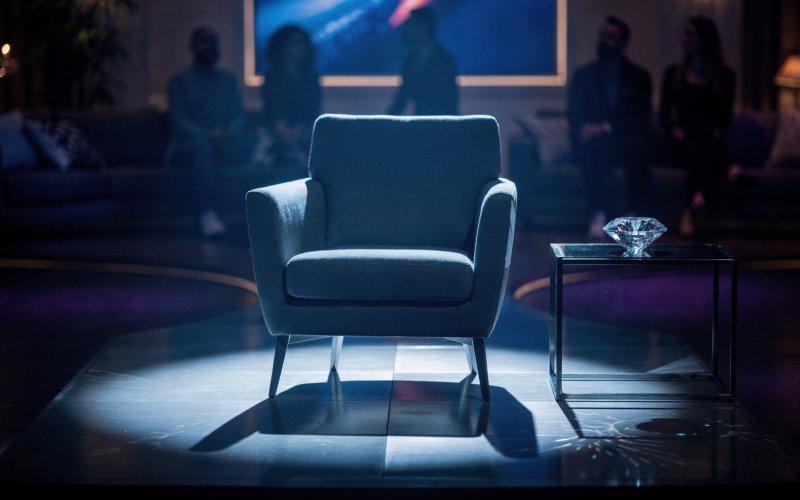 Big Brother 28 week 3 nomination set with a spotlighted empty chair and a Diamond Power of Veto gemstone