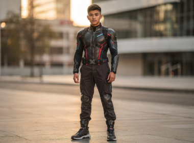 Person wearing cosplay-inspired streetwear on a city sidewalk in golden hour light