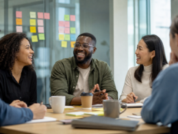 A team collaborating together, illustrating how to improve team morale