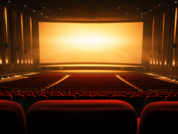 Empty premium large format movie theater auditorium with a bright illuminated screen