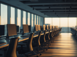 Rows of empty desks in an open plan office