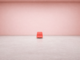Single vivid coral stadium seat standing alone in a vast empty pale pink room