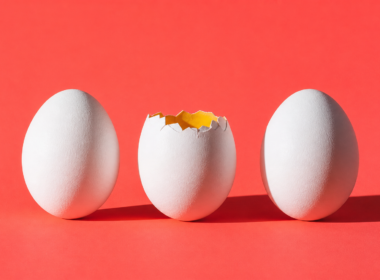 Big Brother 28 veto ceremony concept, three white eggs on coral with the middle one cracked