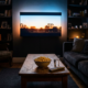 A cozy dark living room with a glowing television screen casting soft light and popcorn on a table