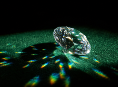 Big Brother 28 Diamond Power of Veto illustrated by a single cut diamond on dark green felt throwing refracted light