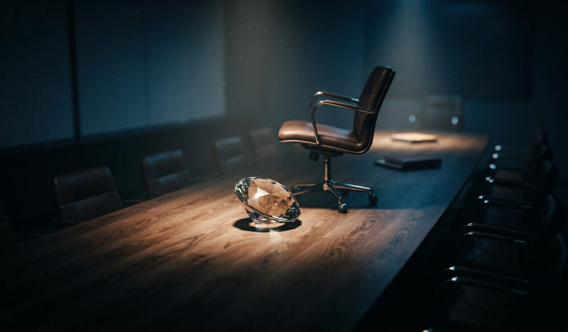 Big Brother 28 spoilers image showing a faceted diamond on a dark boardroom table with one empty chair pushed back