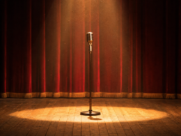 Dolly Parton tribute specials, empty stage with a scarlet curtain and one microphone in a spotlight