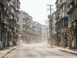 Heat shimmer rising off a sun bleached city street with balcony air conditioners during the East Asia heat wave