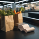 Grocery prices affordability shown by a supermarket conveyor belt with produce bags and a credit card resting on a long receipt