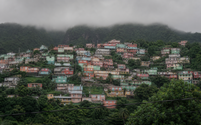 Haiti Kenscoff attack, brightly painted hillside houses stacked up a mountain under low grey cloud