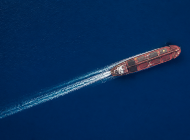 Iran sanctions markets concept, aerial view of a single oil tanker on deep blue open ocean