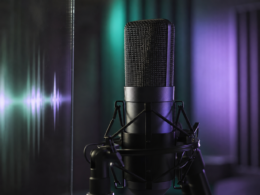 Jin 1 billion Spotify streams shown by a studio condenser microphone lit in green and violet