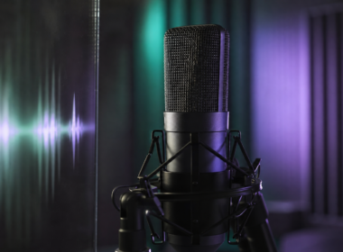Jin 1 billion Spotify streams shown by a studio condenser microphone lit in green and violet