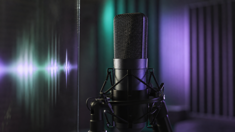 Jin 1 billion Spotify streams shown by a studio condenser microphone lit in green and violet