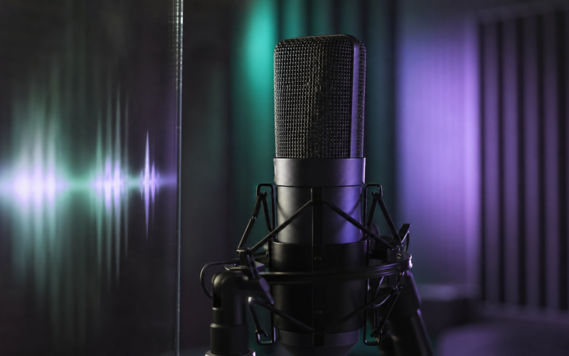 Jin 1 billion Spotify streams shown by a studio condenser microphone lit in green and violet