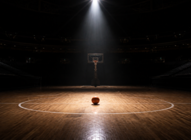 Kelsey Mitchell WNBA scoring streak, empty arena with a basketball under a spotlight