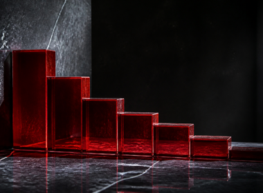 Nike stock decline shown as a descending row of red glass blocks on dark polished stone