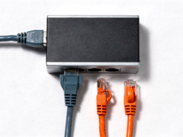 OpenAI cuts off Cursor illustrated by a network switch with one cable connected and two left unplugged