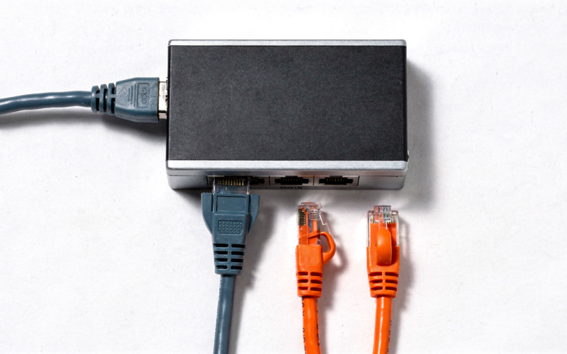 OpenAI cuts off Cursor illustrated by a network switch with one cable connected and two left unplugged