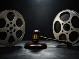 Paramount Warner merger concept: two film reels and a gavel on a dark table