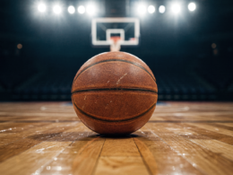 Golden State Valkyries concept: a basketball on a hardwood court under bright arena lights